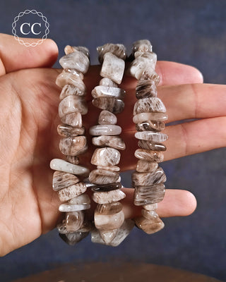 Sealstone Bracelets on hand on blue background