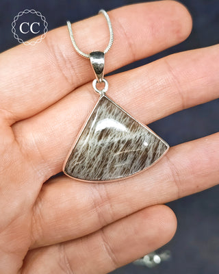 Sealstone Silver Necklace on a silver chain in hand