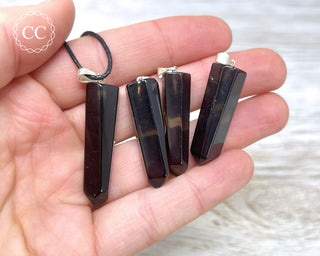 Smoky Quartz Point Pendants in hand