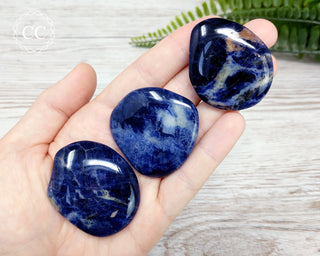 Sodalite Palm Stones in hand