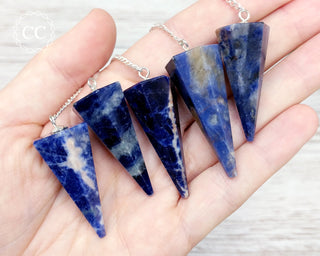 Sodalite Pendulums in hand
