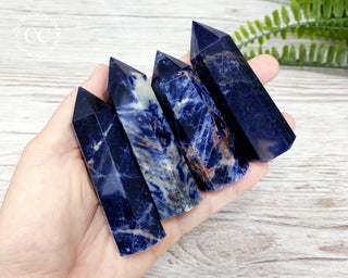 Sodalite crystal towers in hand