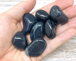 Spiderweb Obsidian Tumbled Crystals in hand