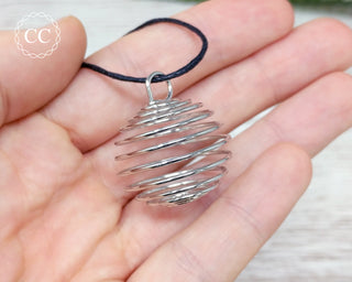 Spiral Cage Necklace in hand
