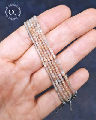 Sunstone & Moonstone Faceted Bracelets in hand