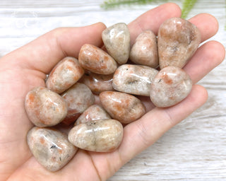 Sunstone Tumbled Crystals in hand