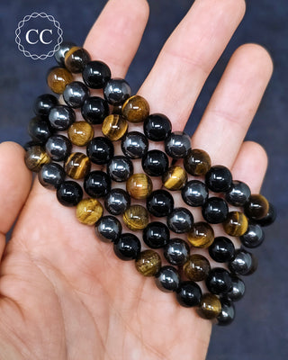 Tigers Eye, Obsidian & Hematite 8mm Beaded Bracelets in hand