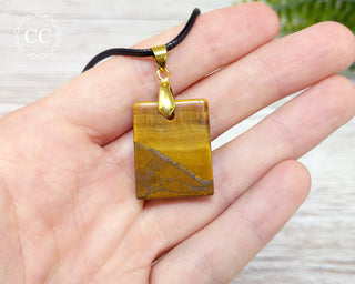 Tigers Eye Slice Necklace in hand