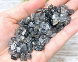 Tourmalinated Quartz Crystal Chips in hand