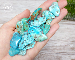 USA Turquoise Tumbled Crystals in hand