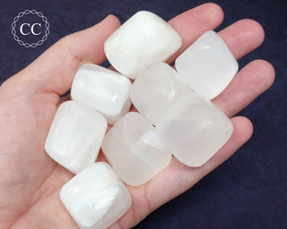 White Calcite Tumbled Crystals in hand