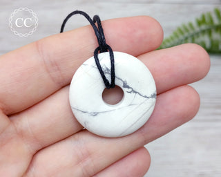 White Howlite Donut Necklace in hand