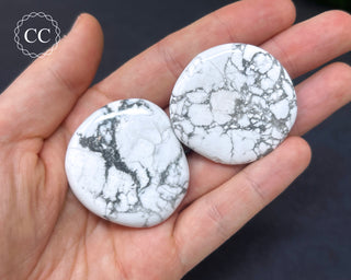 White Howlite Palm Stones in hand