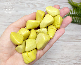 Yellow Serpentine Tumbled Crystals in hand