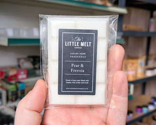 Pear and Freesia wax melt bar in hand