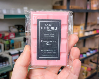 Pomegranate Noir wax melt bar in hand 