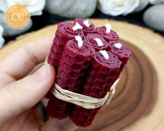 Mini Burgundy Rolled Beeswax Candles on wooden background