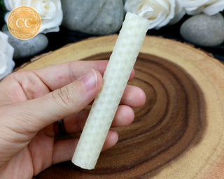 Ivory Rolled Beeswax Candle on wooden background