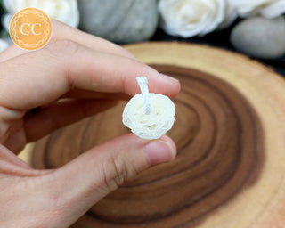 Ivory Rolled Beeswax Candle on wooden background