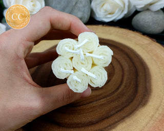 Ivory Rolled Beeswax Candles on wooden background