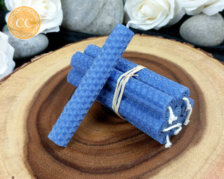 Blue Rolled Beeswax Candles on wooden background