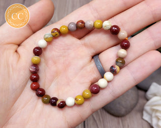 Mookaite 6mm beaded bracelet in hand