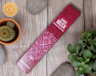 Shree Musk Incense sticks on wooden background