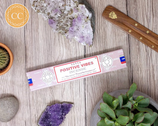 Satya Positive Vibes Incense sticks on wooden background
