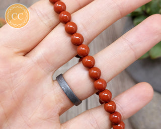 Red Jasper 6mm Beaded Bracelet in hand