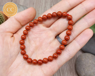 Red Jasper 6mm Beaded Bracelet in hand