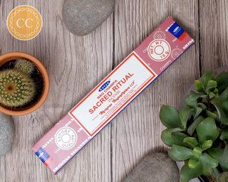 Satya Sacred Ritual Incense sticks on wooden background