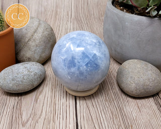 Wooden Ring Stand with blue calcite sphere 